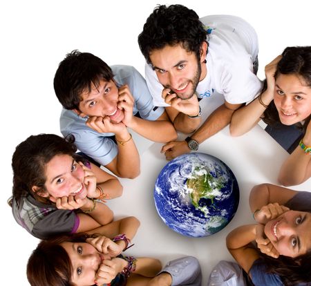 group of young ecologists smiling at the camera with a globe in the middle of them