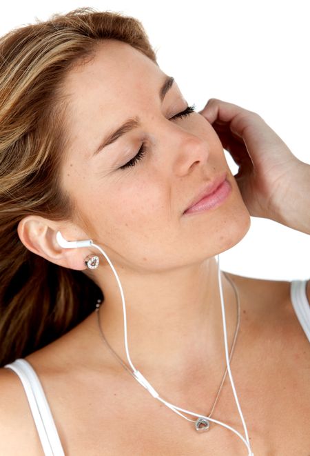 Woman listening to music with eyes closed isolated over a white background