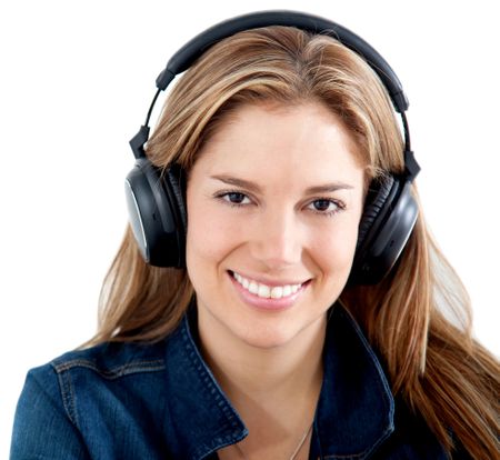Casual woman listening to music isolated over a white background