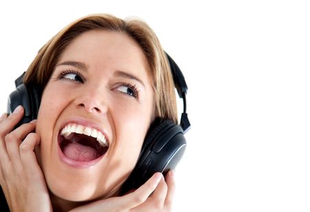 Happy woman listening to music isolated over a white background