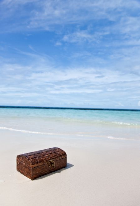 Treasure chest on a beautiful sandy beach