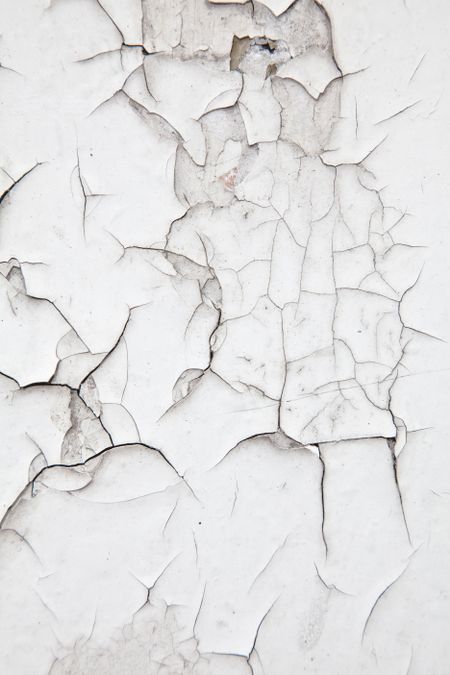 Old white cracked wall background