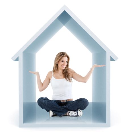 Beautiful woman smiling inside a 3d house isolated over a white background
