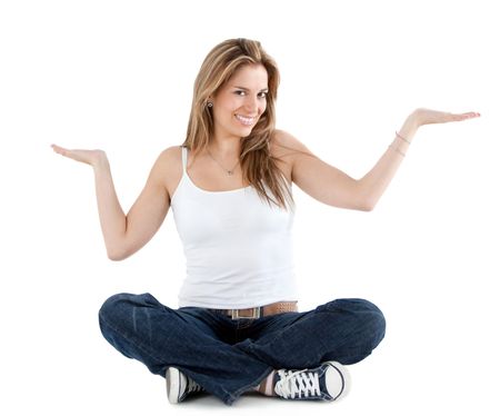 Beautiful woman smiling with her hands facing up displaying something isolated over white