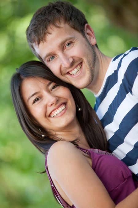 Beautiful couple portrait smiling outdoors