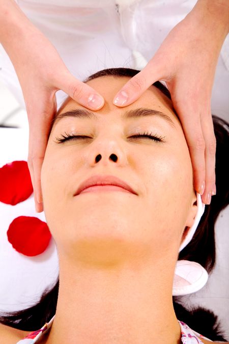 girl looking relaxed while having a beauty facial massage