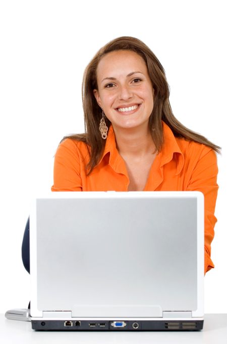 Business woman on a laptop computer in her desk isolated over a white background