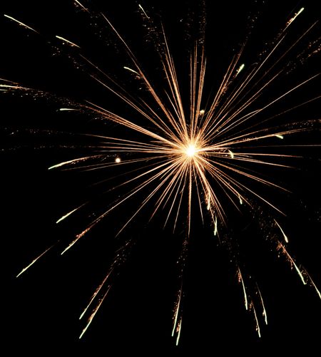 Bright burst of fireworks with glittery streaks
