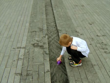 Little boy playing with water