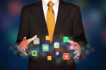 Elegant businessman holding colorful mixed media icons 