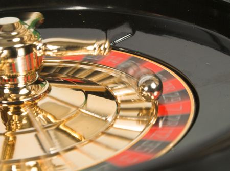 casino roulette in motion with ball moving also