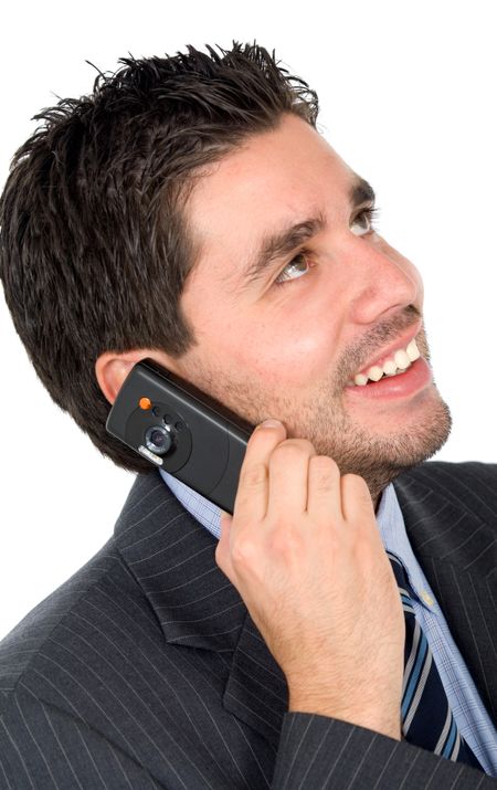 Business man on the phone smiling - isolated over a white background