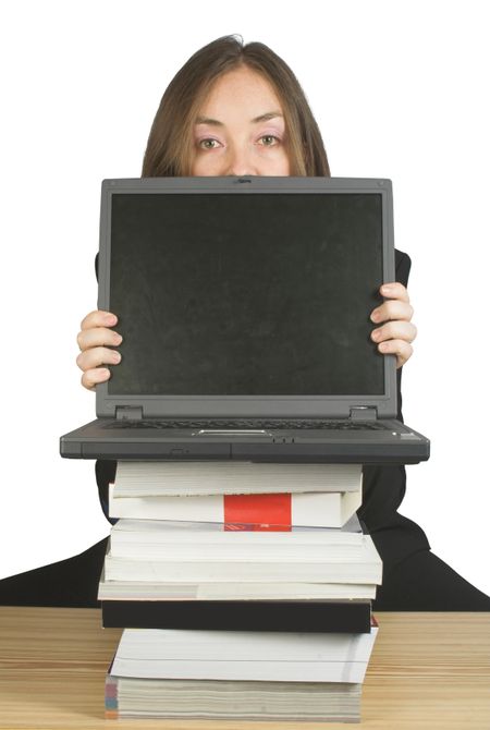 business woman with her laptop behind some books