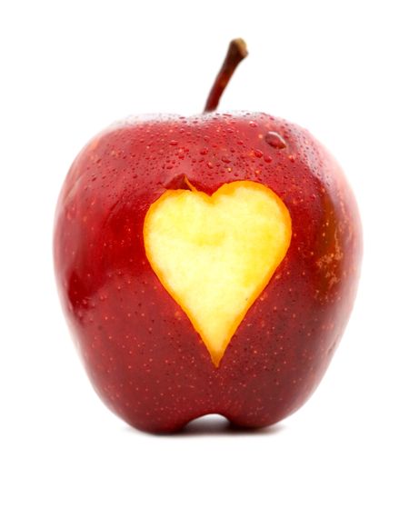 apple with a heart shape on it - isolated over a white background