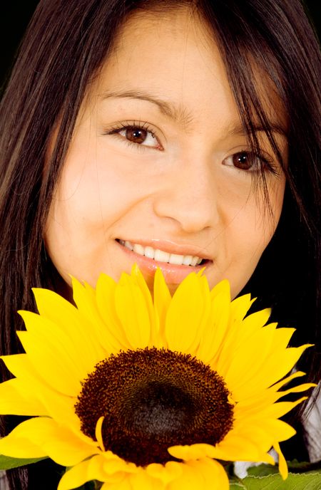 beautiful fashion girl portrait with a sunflower
