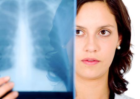 female doctor checking an xray isolated over a white background