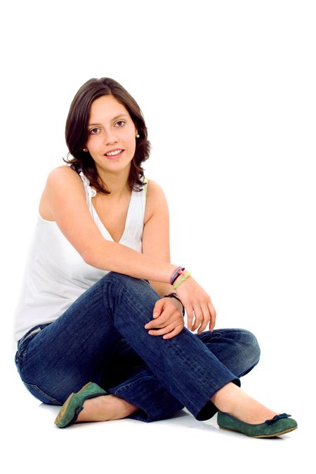 Casual woman portrait on the floor smiling over a white background