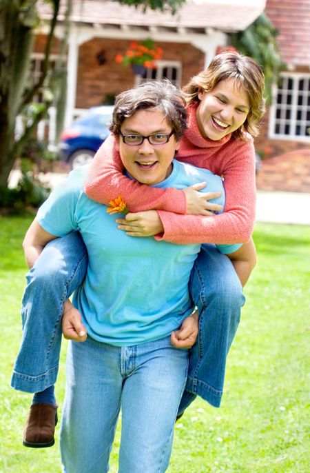 couple smiling and having fun outdoors at home