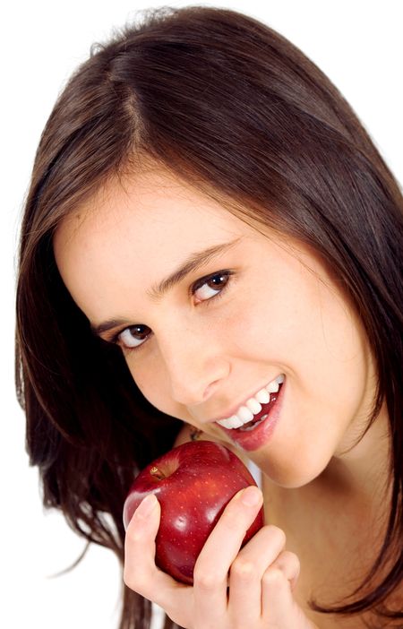 beautiful girl eating an apple - isolated over white
