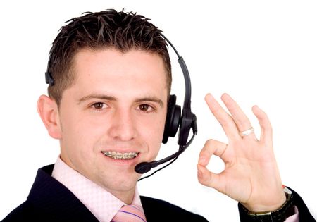 male customer service representative smiling over a white background - note the guy is wearing braces