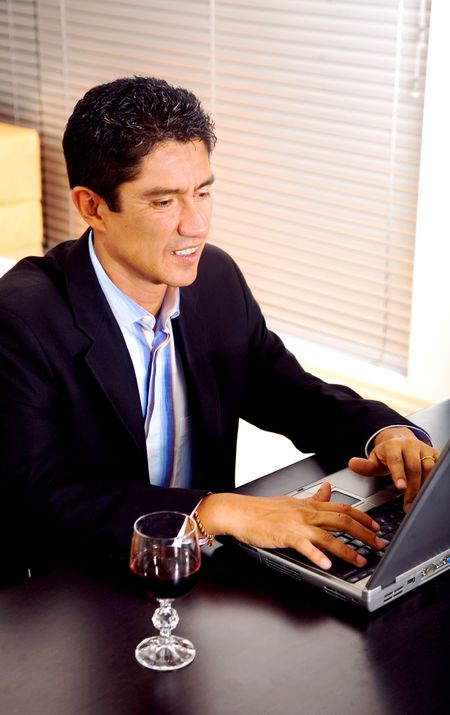 business man working from home on a laptop computer