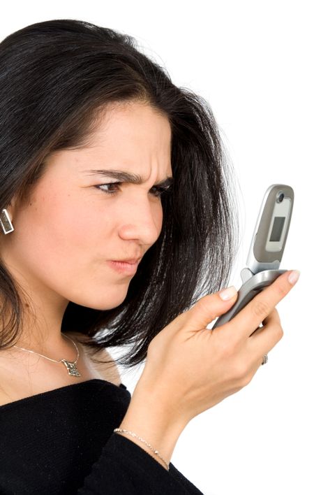 business woman angry with technology isolated over a white background