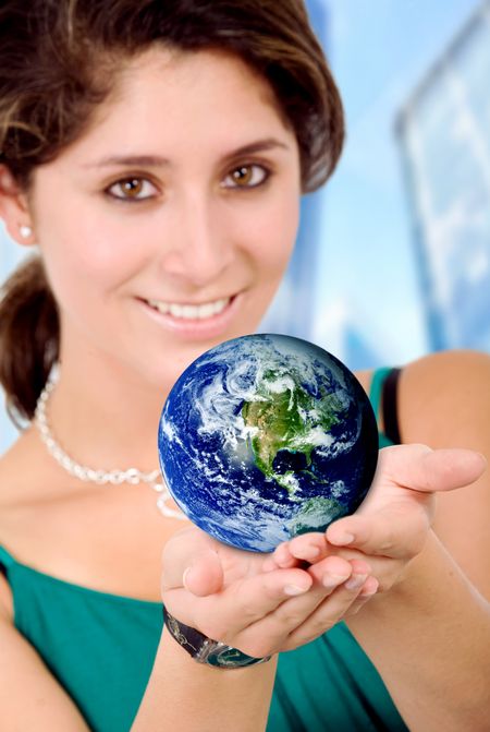 Business woman holding a globe in her hands good for a worldwide concept