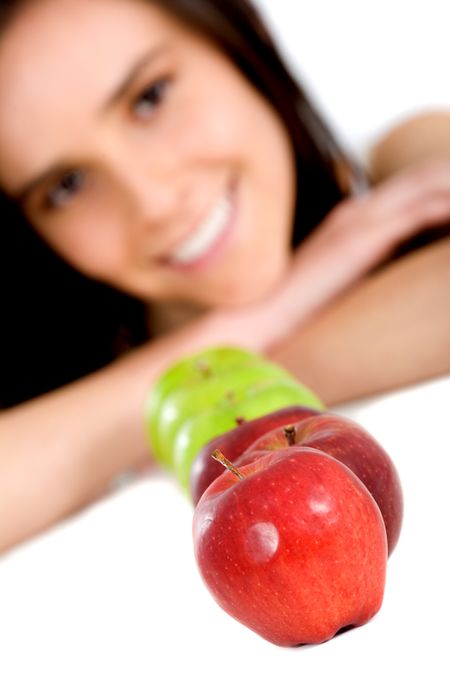 girl with apples in front of her - isolated over a white background