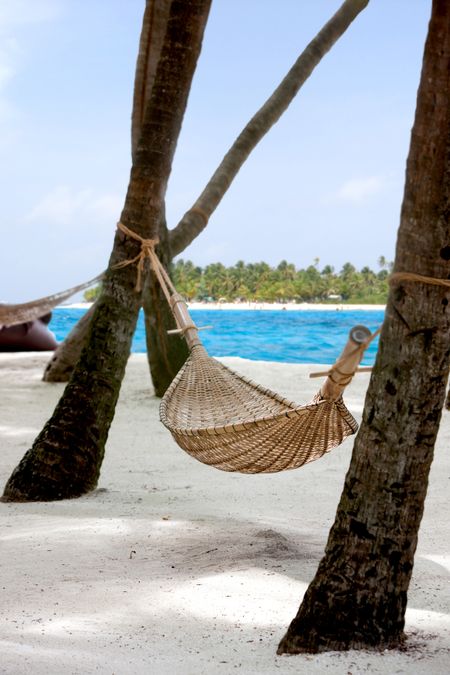 Hammock on the beach in a beautiful relaxing panorama