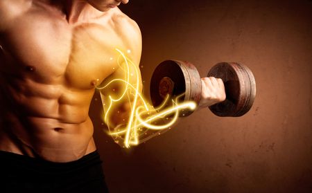 Muscular body builder lifting weight with energy lights on biceps concept