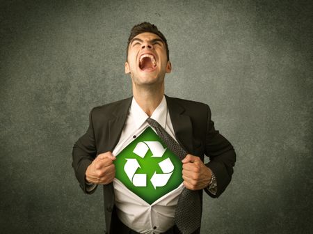 Enviromentalist business man tearing off shirt with recycle sign on his chest concept on backround