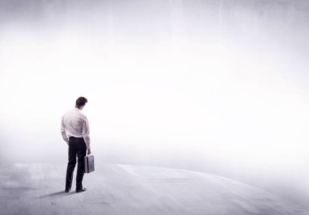 Young sales businessman in elegant suit standing with his back in empty white space background concept