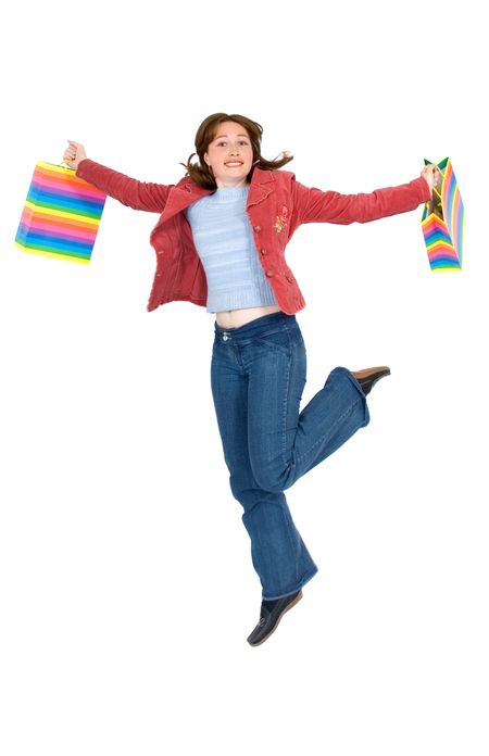 happy girl smiling holding shopping bags - isolated over a white background