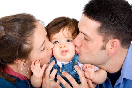 family portrait kissing their little daughter isolated over a white background