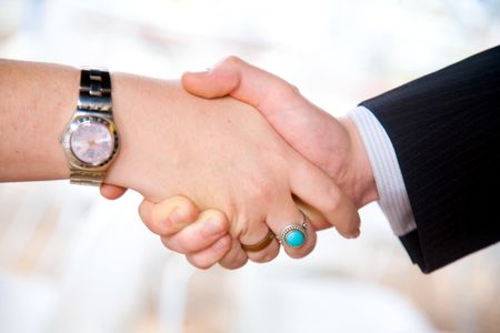business deal with success between a businessman and a businesswoman