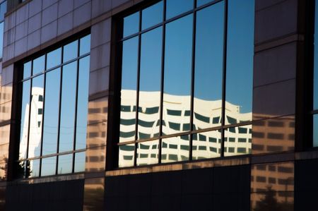 Reflection of office building in windows of another