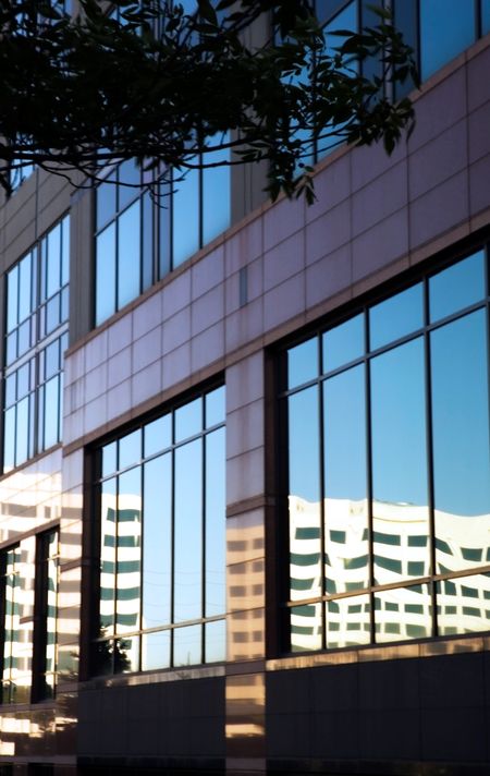 Reflection of office building in windows of another