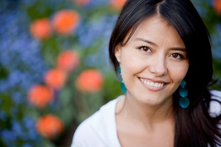 Portrait of a beautiful woman smiling outdoors