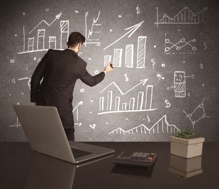 A young marketing office worker drawing pie chart and graph on wall at financial meeting concept