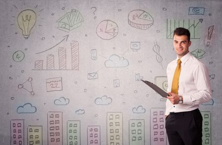 A young adult businessman standing in front of a wall with colorful drawings of buildings, charts, graphs, signs concept