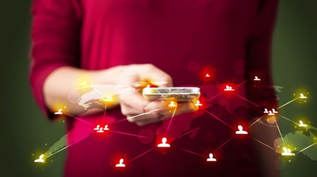 Smart woman holding telephone with world social media network connection