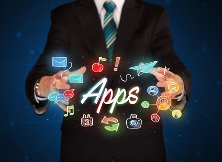 Businessman with drawn application icons and symbols in his hands 