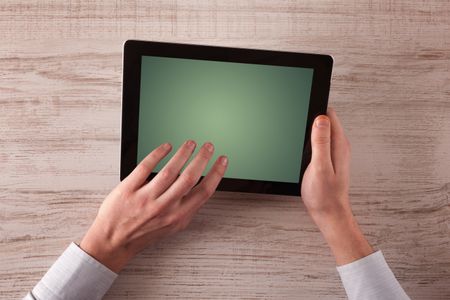 Caucasian business hands holding and working on plain tablet