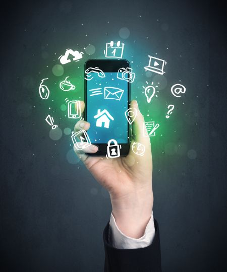 Caucasian hand in business suit holding a smartphone with drawn web icons