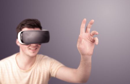 young-impressed-man-wearing-virtual-reality-598963124 Young impressed man wearing virtual reality goggles