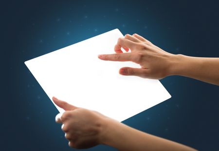 Young female hand holding and touching a piece of glass meant to look like a tablet