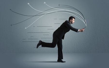 Running businessman with device and hand drawn lines concept on background