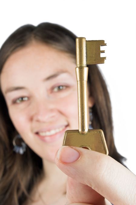 beautiful woman holding a golden key