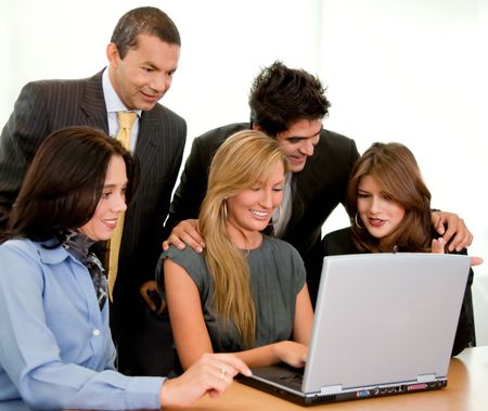 Business group working with laptop isolated over a white background
