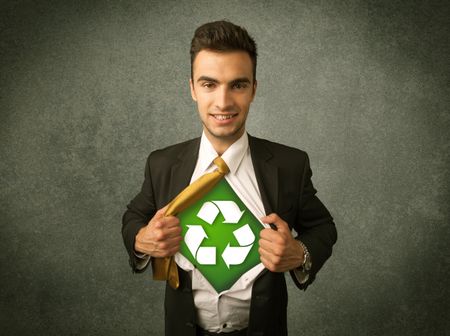 Enviromentalist business man tearing off shirt with recycle sign on his chest concept on backround